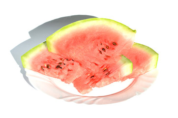 Ripe watermelon pieces on the plate isolated on white, delicious berry