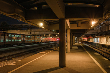 Train platform sitting empty waiting for trains in urban Chicago