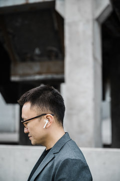 Portrait of businessman using bluetooth headsets