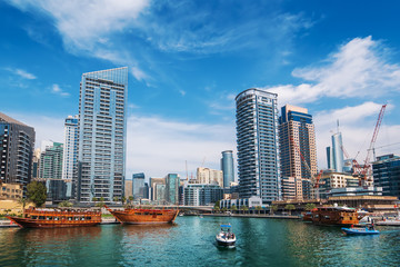 Fototapeta na wymiar Dubai Marina skyscrapers and boats in water canal, Dubai, United Arab Emirates.