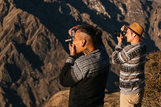 Two friends taking pictures of nature