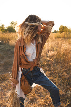 Beautiful blonde woman in the field