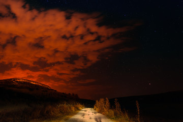 nightview of mountain under red clouds