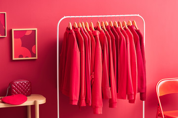 Collection of hoodies in red room