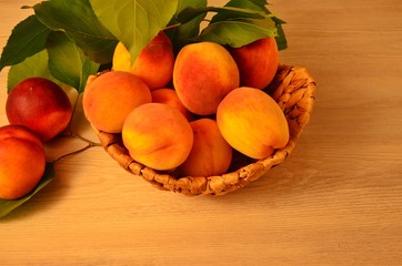 ripe nectarine and peaches on a wooden table