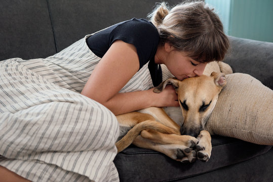 Loving pet owner with adopted dog