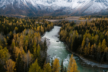 View of a winding river and autumn forest