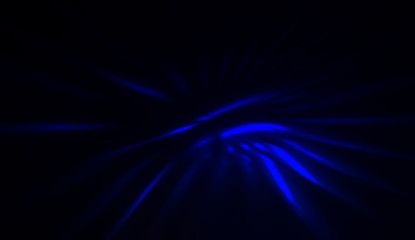 Light particles in motion, creating a burst of glowing multicolored rays on a black background. Energetic glow lights wallpaper.