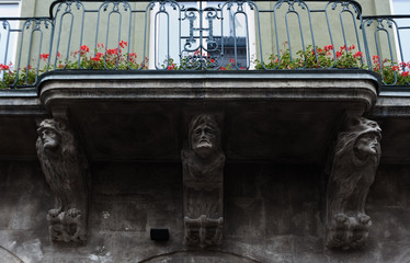 Architectural corbels on the old building on Market Square in Lviv, Ukraine