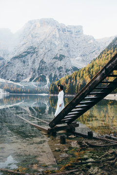 Young woman at beautiful mountain lake