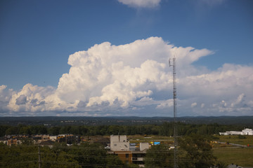 Large white, puffy clouds in sky during the day