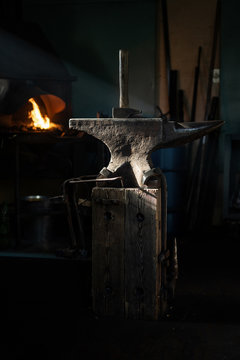 Anvil and hammer in blacksmith workshop.