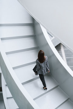 Businesswoman on office staircase