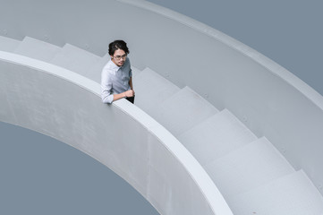 Businessman walking on office stairs