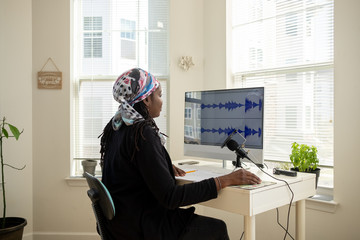 Woman recording a Podcast