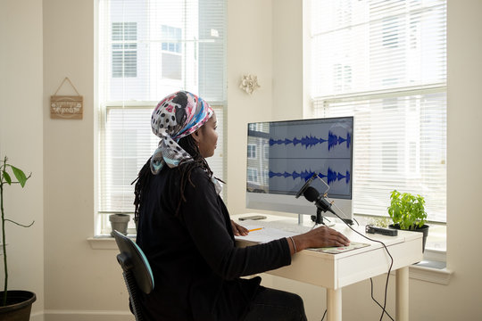 Woman recording a Podcast