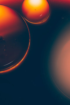 Abstract orange spheres under microscope