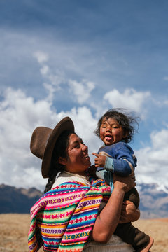Indigenous mom holding her son