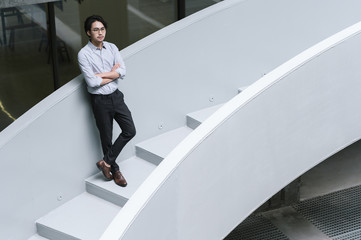 Businessman on office stairs