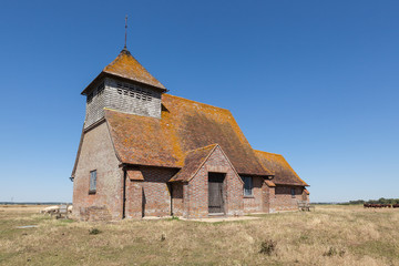 St Thomas à Becket Church in Fairfield, Kent, on a sunny day.