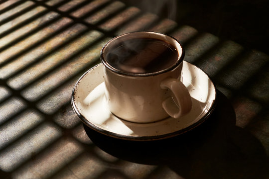Hot Cup of Coffee with Shadows