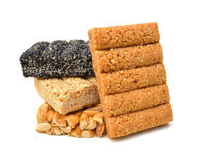 Honey bars with peanuts, sesame and sunflower seeds isolated