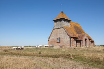St Thomas à Becket Church in Fairfield, Kent, on a sunny day.