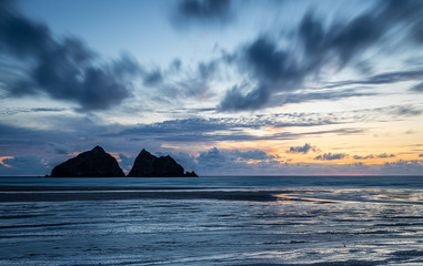 Gull rocks at sunset in Hollywell Bay in Cornwall