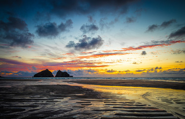 Gull rocks at sunset in Hollywell Bay in Cornwall