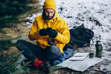 Climber playing games and relaxing after long difficult travel.