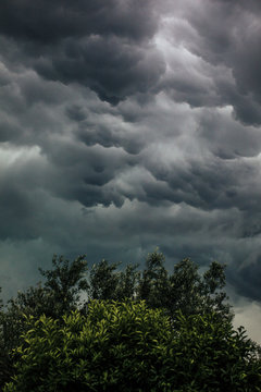 Dramatic storm dark rainy clouds moving over the sky