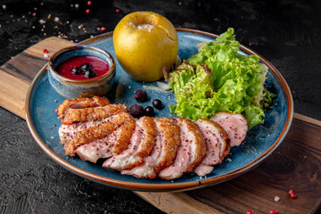Duck breast in berry sauce with baked apple. Grilled poultry