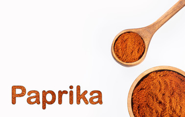 Capsicum annuum - Organic paprika powder in wooden spoon