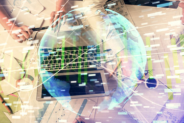 Double exposure of man and woman working together and financial theme hologram. international business concept. Computer background.