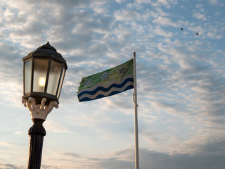 Fototapeta na wymiar Cumberland county flag during golden hour 