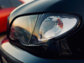 Car headlight close-up, Sunlight in glass