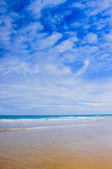Fototapeta na wymiar Summer beach background. Sand, sea and blue sky. ocean