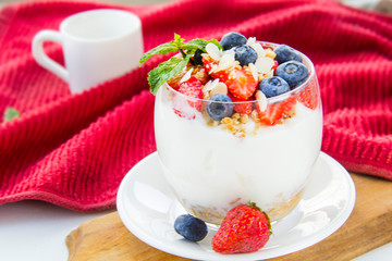 Healthy blueberry, strawberry and walnut parfait in a glass 