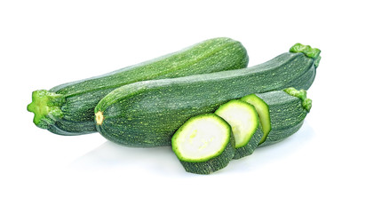 fresh green zucchini with slice isolated on white background