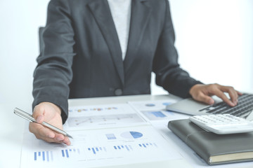 Businesswoman analysis the chart with laptop at the office for setting challenging business goals And planning to achieve the new target