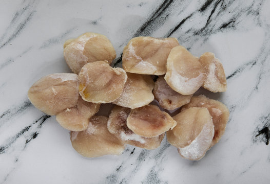 Fish. Frozen pollock cheeks ready for cooking. 