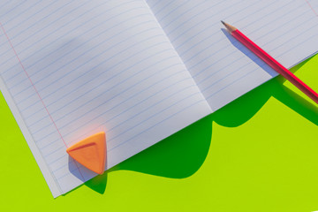 September 1 on a wooden calendar among the supplies for study on a blue background. Back to school...