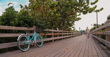 boardwalk in miami beach boardwalk people tourist walking down the walkway in south beach in  South Beach Boardwalk or Beachwalk since much of it spans through the hottest destinations on South Beach.
