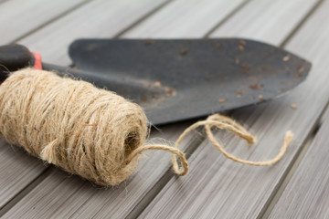 Twine and Garden Trowel on Wood Table with Room for Copy