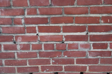 Old brick wall with holes background