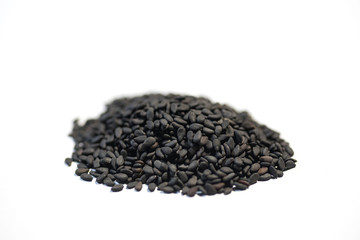 black sesame seeds on white background
