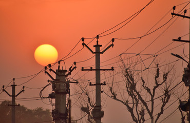 Electric power lines at sunset