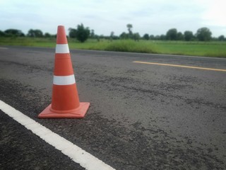 road construction with a red rubber cone in front