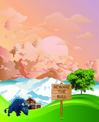 Picturesque rural scene with beware the bull sign on summer mountainous lowland pastures set against a dawn or dusk sky