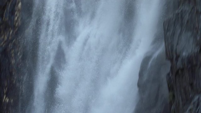 Close-up of how the water falls in the Venosc waterfall, French Alps. 4K